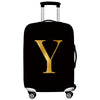 Black luggage with a gold letter Y print and a silver handle