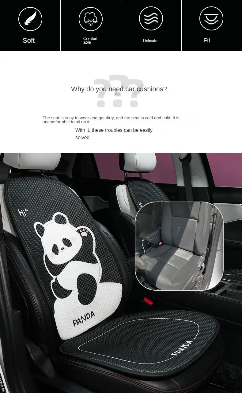 A black car seat cover featuring a white panda design and headrest pillows installed in a vehicle interior.