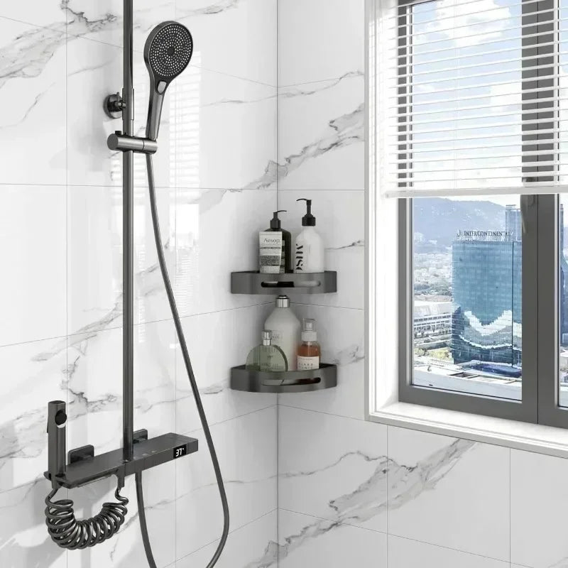 A black shower fixture mounted on a white marble tiled wall with a window view.