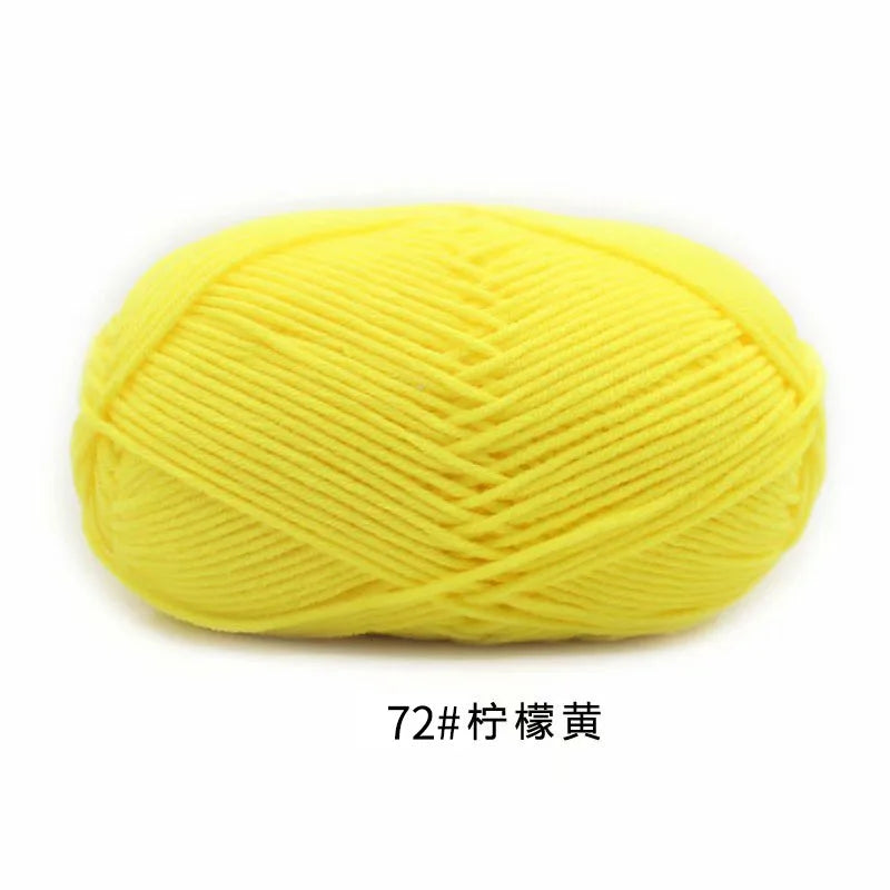 A ball of bright yellow 4-ply milk cotton yarn for knitting and crochet.