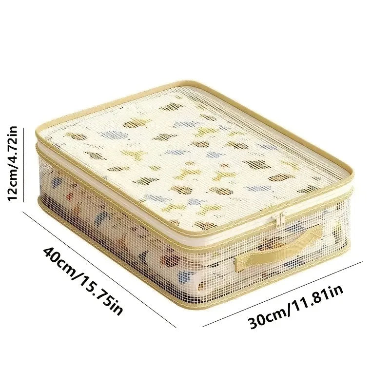 A beige foldable bedding storage bag with a mesh top and handles, shown from above.