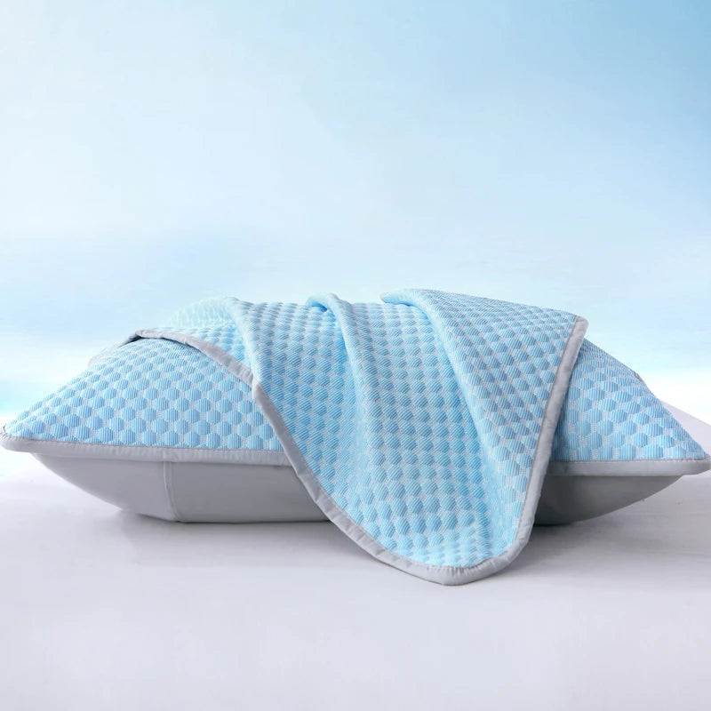 Light blue breathable cooling pillowcase folded on a white surface.