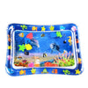 A blue inflatable water play mat filled with colorful plastic sea creatures for baby sensory development.