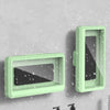 A light green universal waterproof shower phone case with an anti-fog screen displayed against a gray wall.
