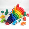 A colorful wooden rainbow stacking block set featuring various colored cones and triangles.