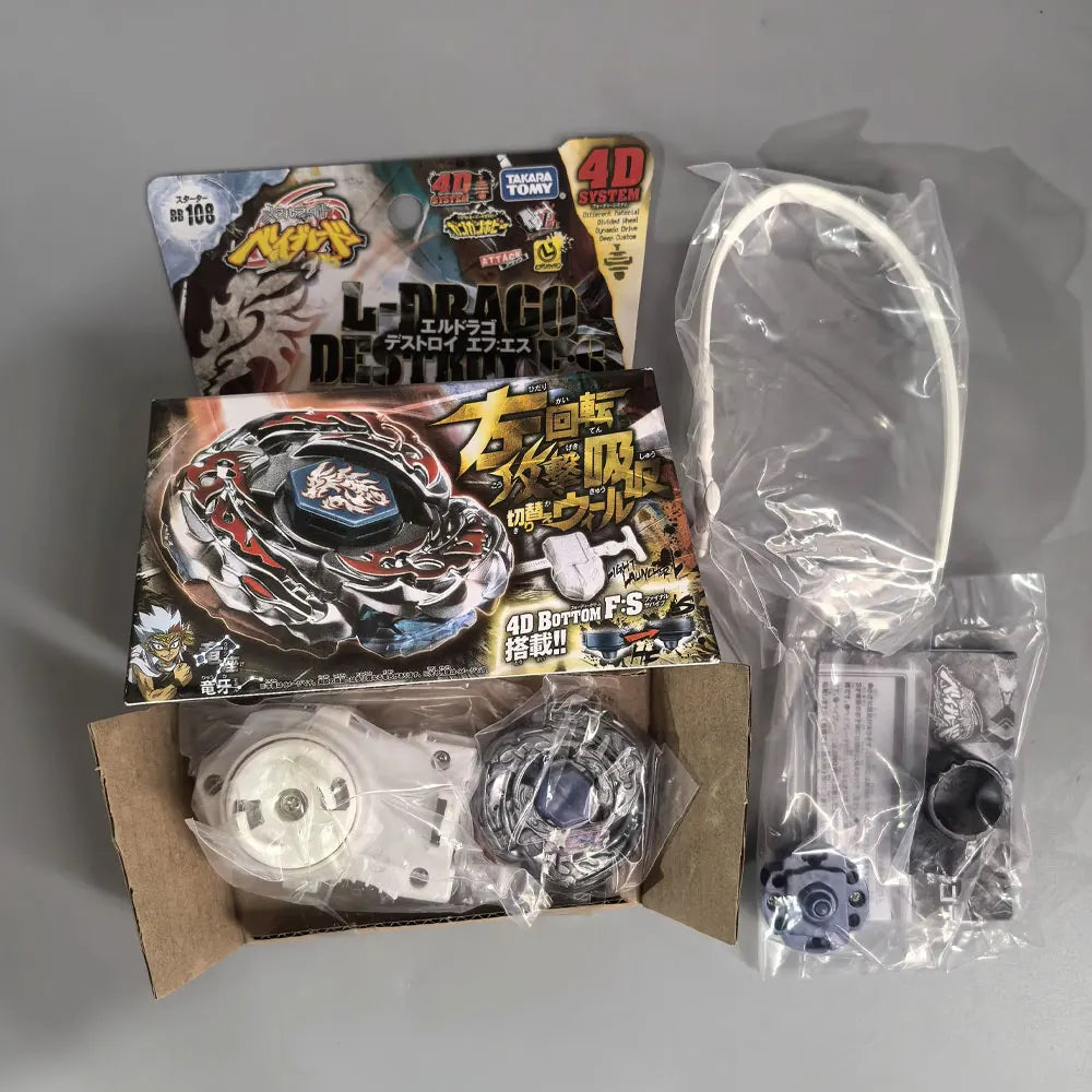 A set of four metal spinning tops and packaging for a battle game featuring a dragon theme.