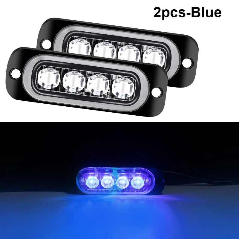 Two blue LED strobe side marker lights shown in a close-up view.