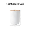 White bamboo toothbrush cup with a wooden lid and a cleaning line embossed on the side.
