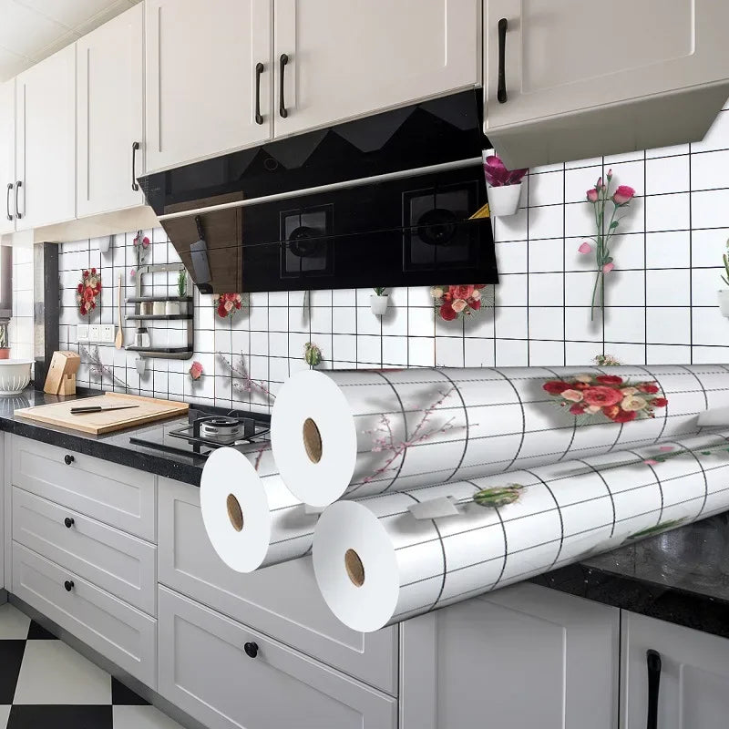 A kitchen splashback featuring silver corrugated rolls and floral accents on a white tiled wall.