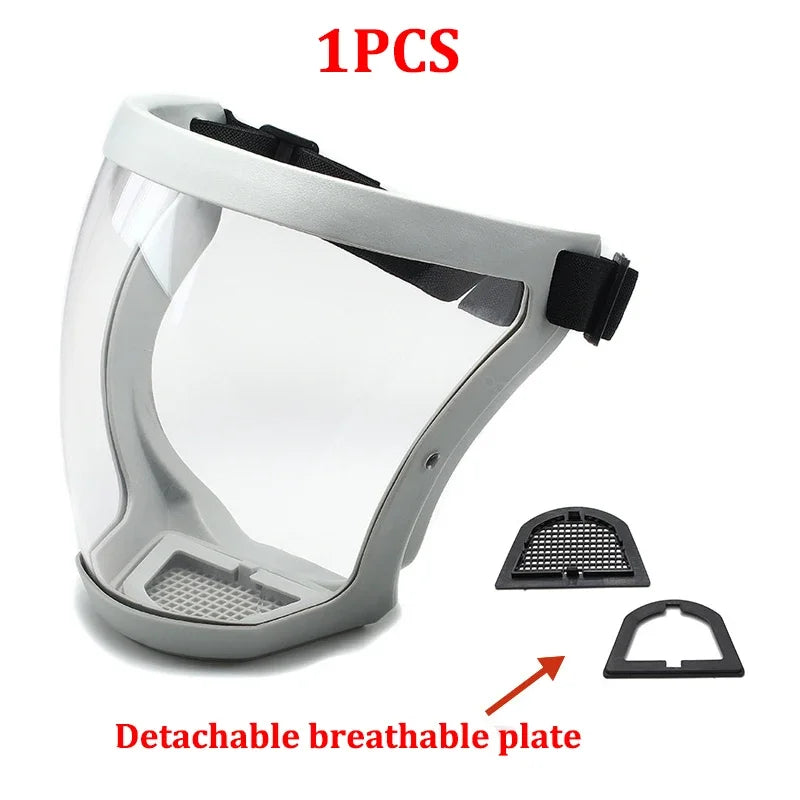 A clear protective face mask with a gray frame and detachable breathable plate shown from above.
