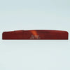 A wooden acoustic guitar bridge saddle with the name Guyker and model ATR-7431 engraved on it.