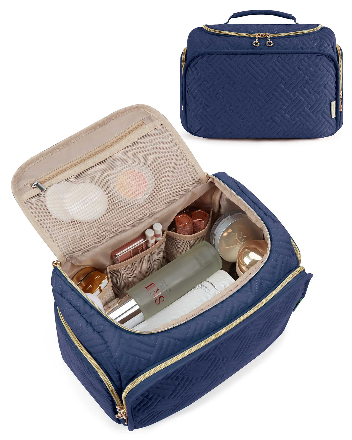 A navy blue quilted travel toiletry bag with a gold zipper and handle, open to show various cosmetic products.