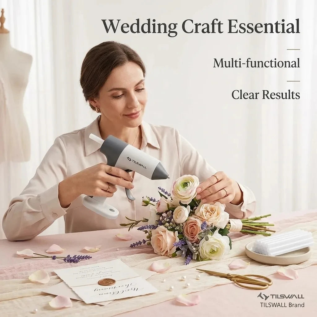 A woman is using a cordless glue gun with a precision nozzle to create floral arrangements.