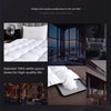 A white goose down duvet and pillows displayed in a luxurious hotel bedroom setting.
