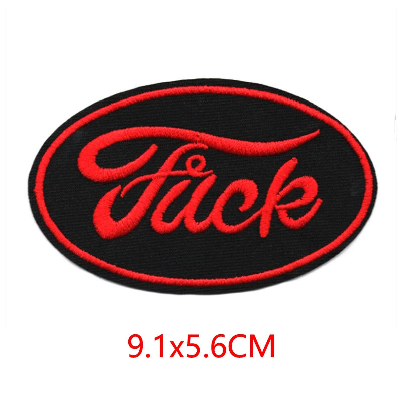 Black embroidered iron-on letter patch with the word Fuck in red script