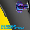 A close-up view of a blue anodized titanium key head with hexagonal features mounted on a dark surface.