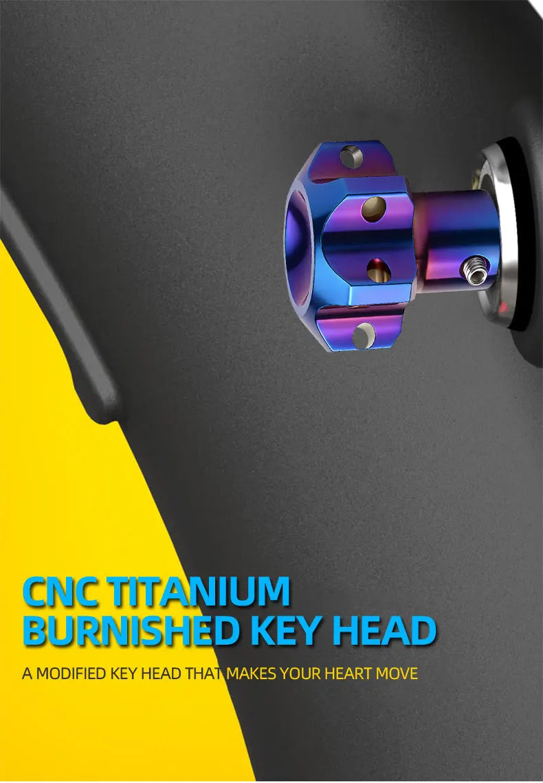 A close-up view of a blue anodized titanium key head with hexagonal features mounted on a dark surface.