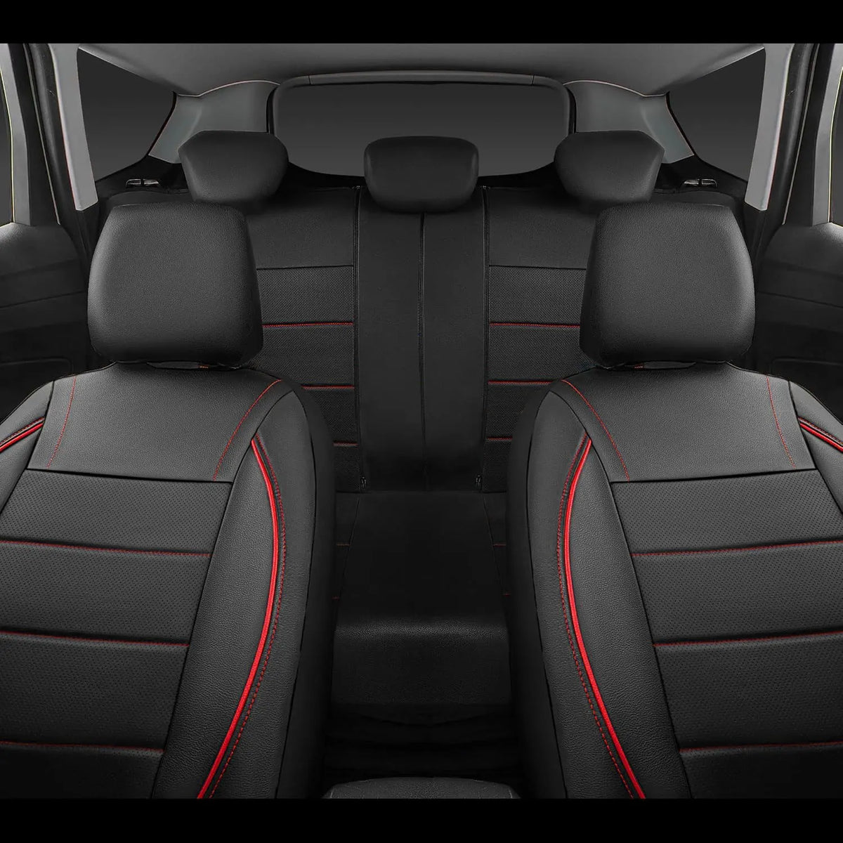 A full set of black leather car seat covers with red stitching shown in the rear interior of a vehicle.