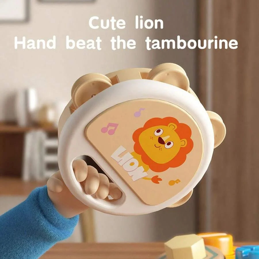 A cute lion hand beat the tambourine, an animal-shaped clapping instrument for toddlers.