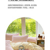 A pink striped duvet cover set with two pillowcases and a yellow sheet on a bed.