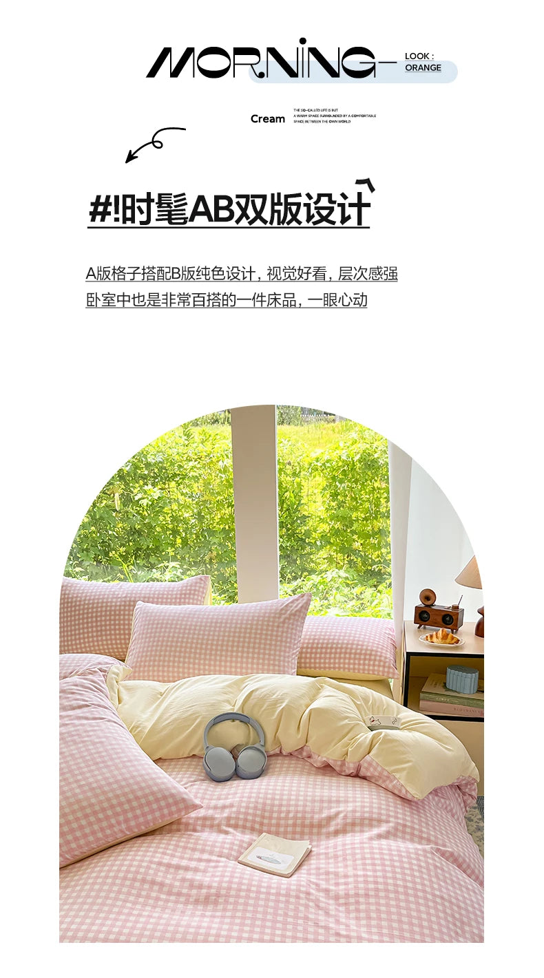 A pink striped duvet cover set with two pillowcases and a yellow sheet on a bed.