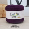 A purple skein of cotton yarn labeled Cotton Yarn 100g with a measurement of 11 cm.