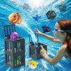 A girl is interacting with floating animal figures in water using a pool diving toy system.