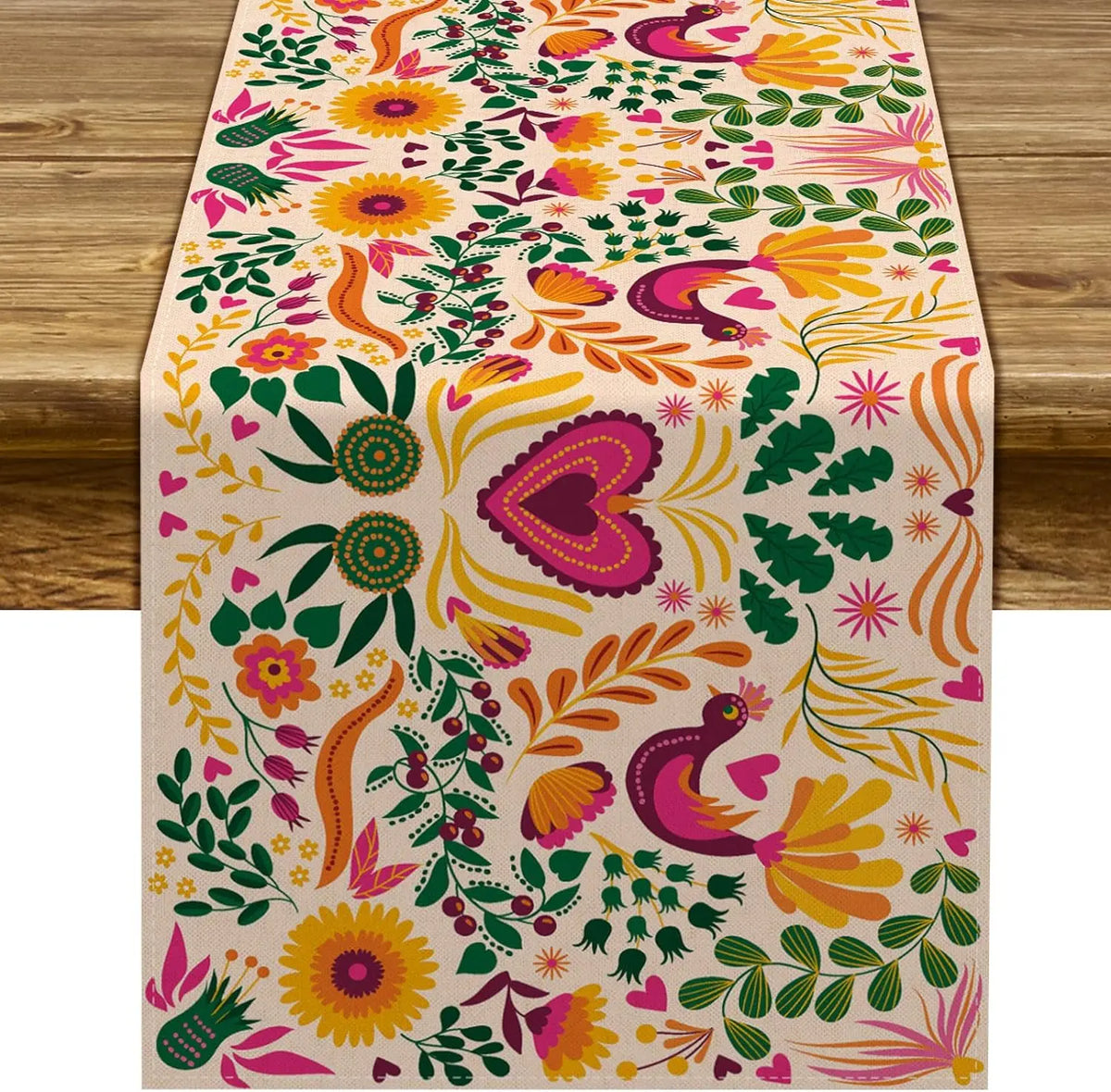 A table runner featuring a vibrant floral pattern in pink, yellow, and green for a Day of the Dead Mexican Fiesta.