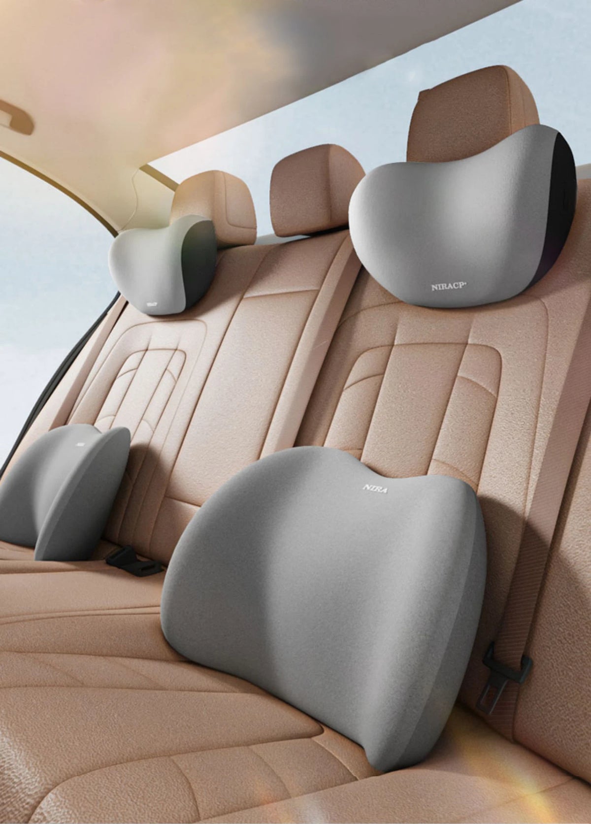 A gray memory foam car headrest and lumbar support pillow are shown installed in a beige car seat.