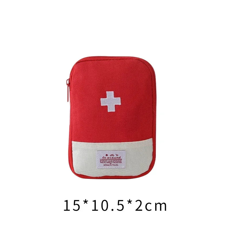 A red portable mini first aid kit organizer bag with a white cross emblem and text on the bottom.
