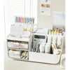 A white multi-function storage organizer featuring a dustproof drawer and trapezoidal compartments for desk supplies.