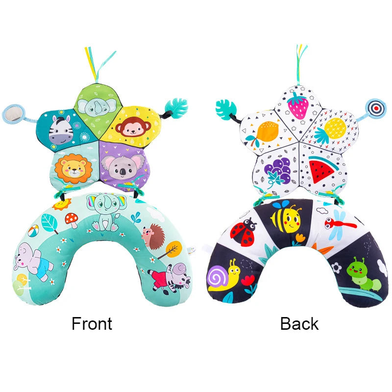 A high contrast tummy time pillow featuring various animal faces and fruit designs for babies.