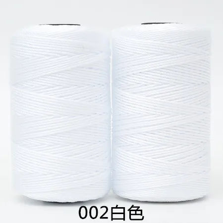 Two spools of white 3-ply polyester knitting yarn for crochet and hand crafts