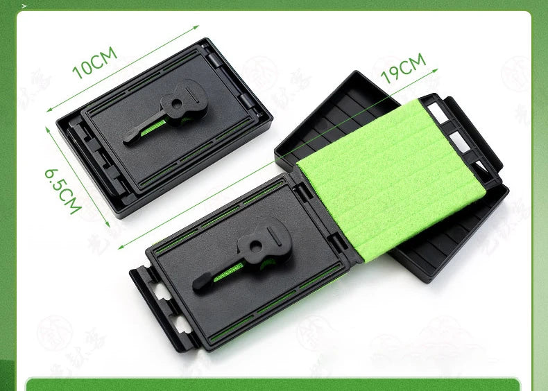 A black guitar fretboard cleaning kit with a green microfiber cloth and measuring lines.