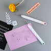 A set of six vinyl weeding and craft tools, including tweezers and other precision instruments, laid on a gray surface.