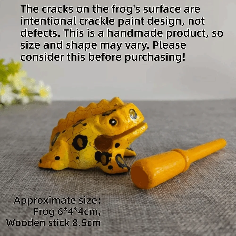A handcrafted wooden frog percussion instrument with intentional crackle paint design resting on a gray surface.