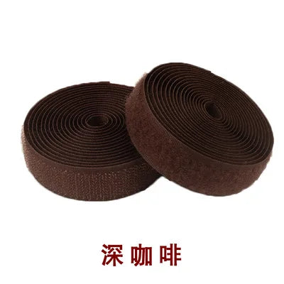 Roll of dark brown sew-on hook and loop tape fastener strip
