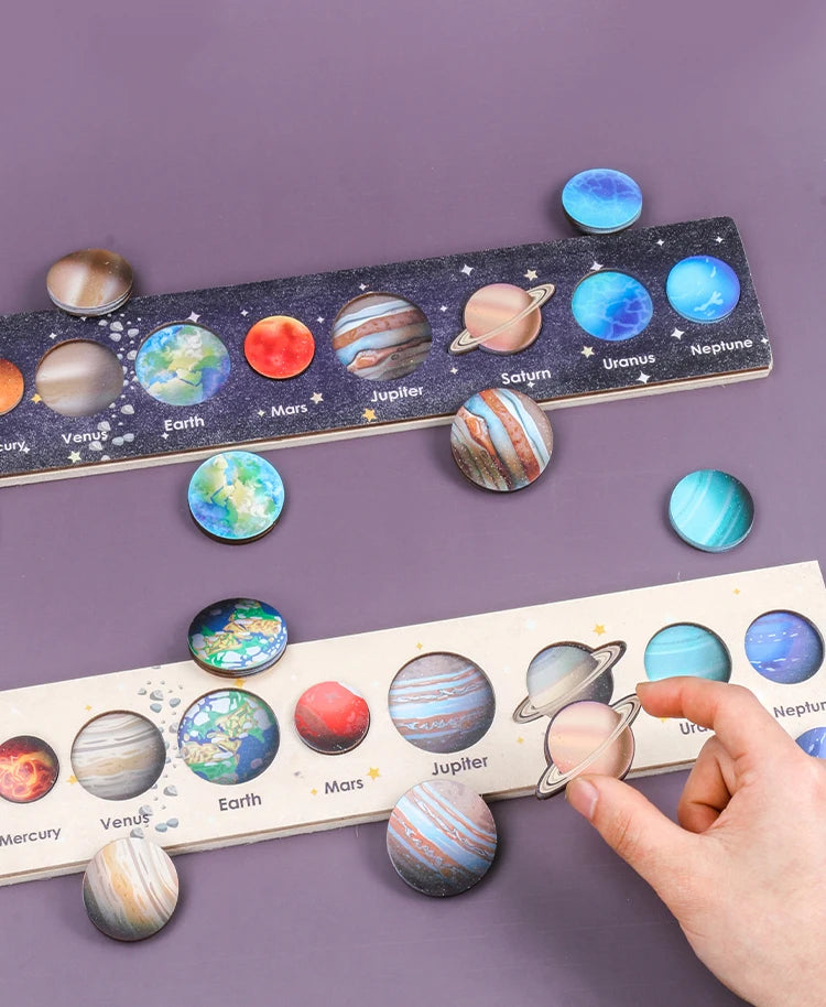 A wooden solar system puzzle featuring planets like Earth, Mars, Jupiter, Saturn, Uranus, and Neptune arranged on a purple ba