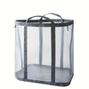 A clear mesh laundry basket with a gray frame and handle.
