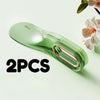 Two green silicone mattress lifter wedge tools are shown on a light green background.