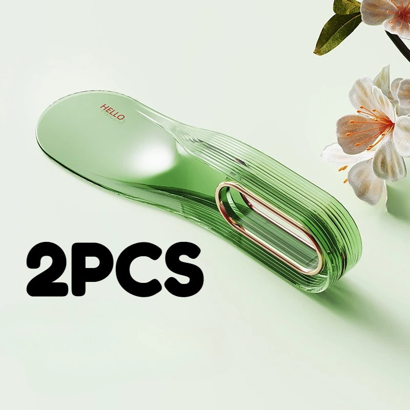 Two green silicone mattress lifter wedge tools are shown on a light green background.