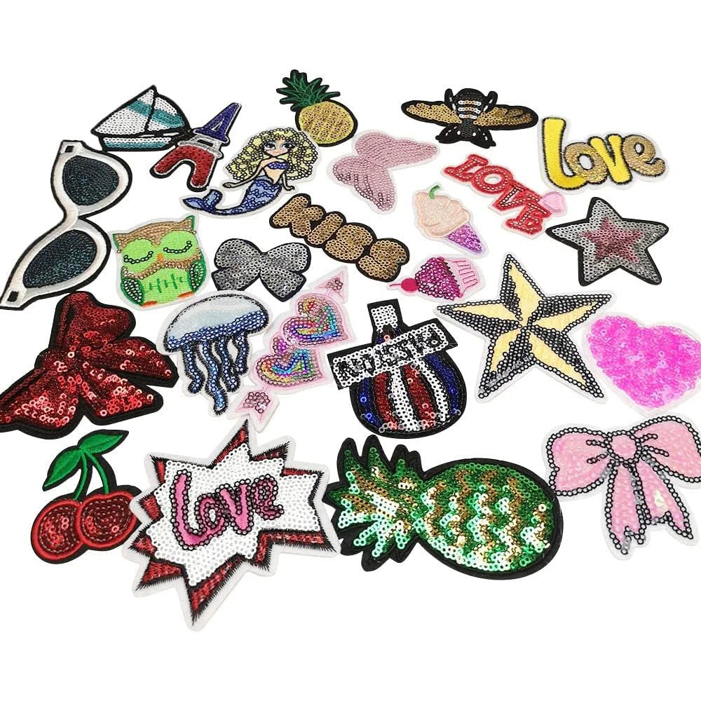 A collection of 30 assorted embroidered iron-on patches featuring various designs and colors.