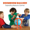 Three children playing with a Boomboom balloon game on a wooden table.