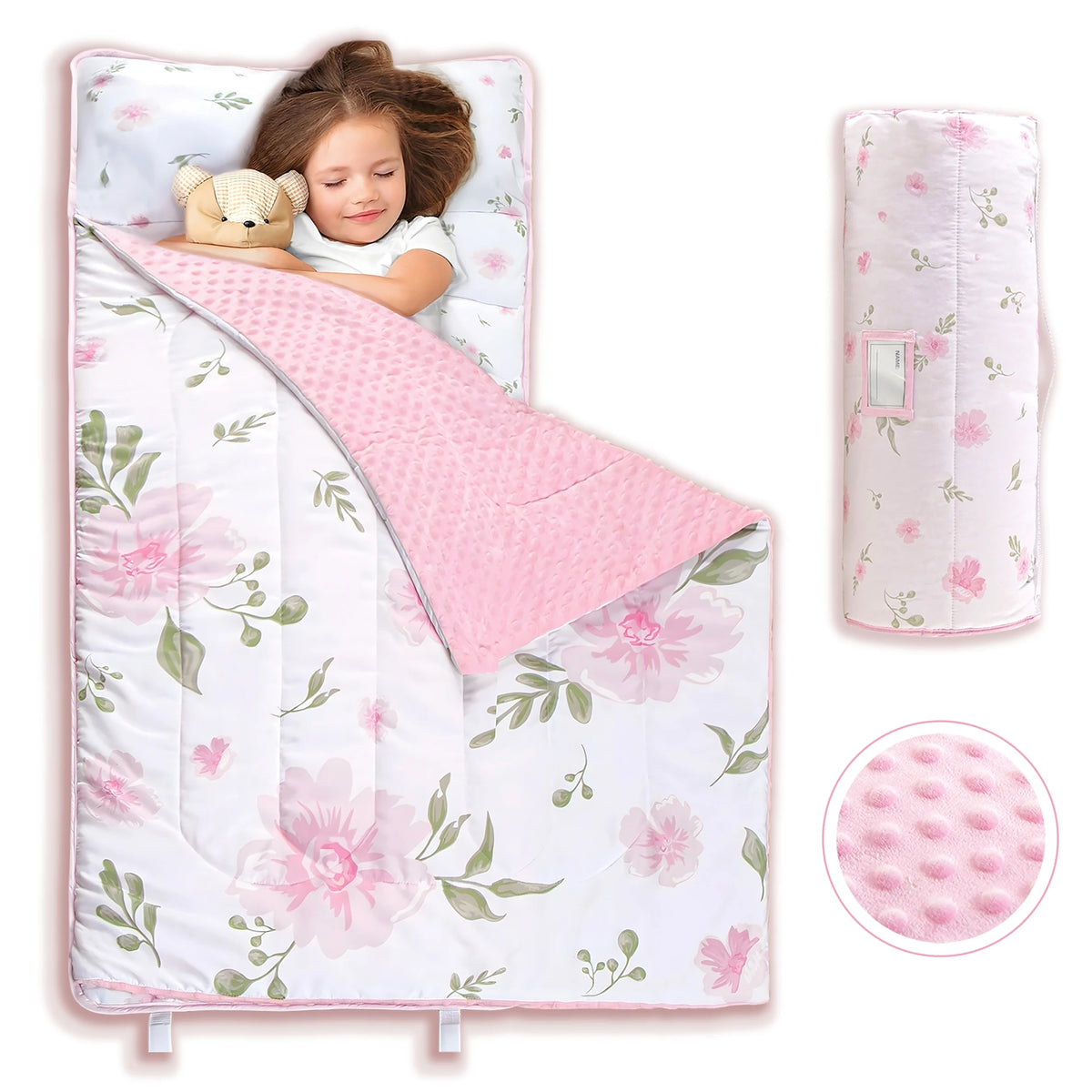 A pink all-in-one toddler nap mat with a removable pillow and fleece blanket featuring floral patterns.
