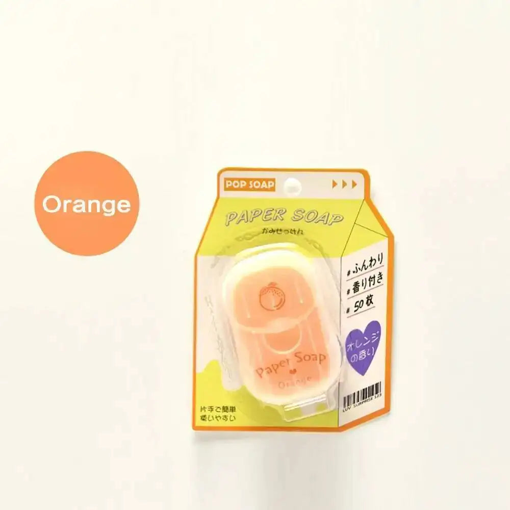 A package of orange paper soap sheets for travel, featuring an orange color and branding.