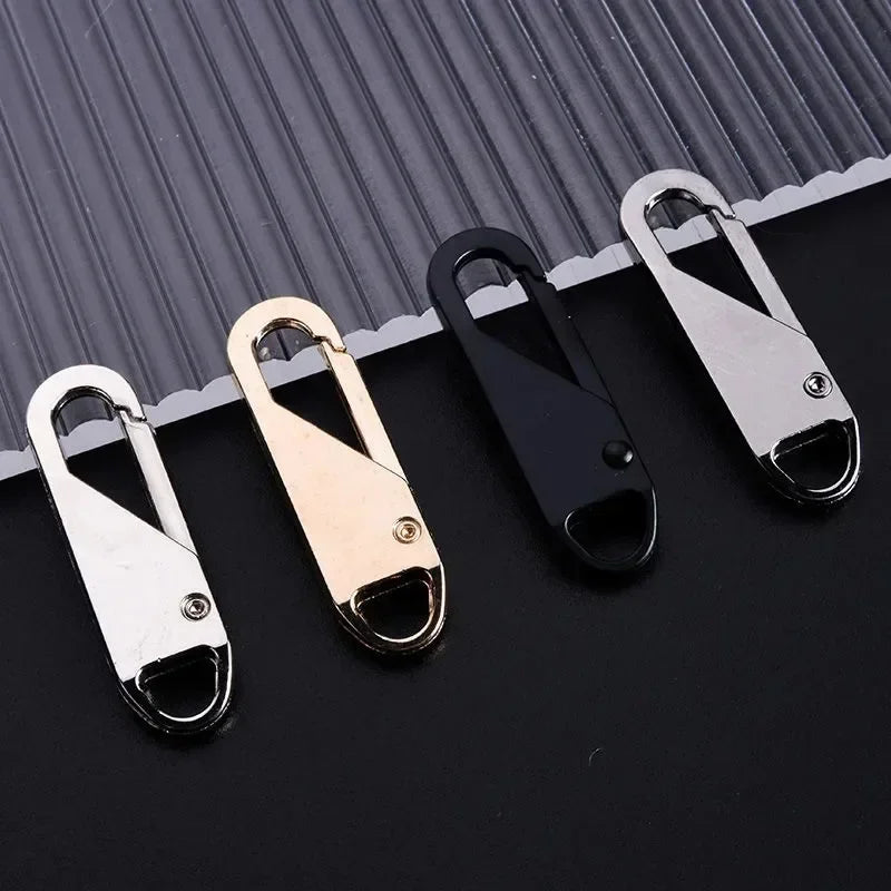 A set of eight universal metal zipper sliders in silver and gold colors displayed on a dark surface.