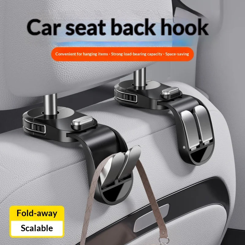 A pair of black car seat back hooks with a fold-away design are shown attached to a white storage container.
