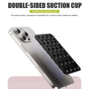 A silver smartphone is shown with a black double-sided suction cup pad attached to the back for mounting.