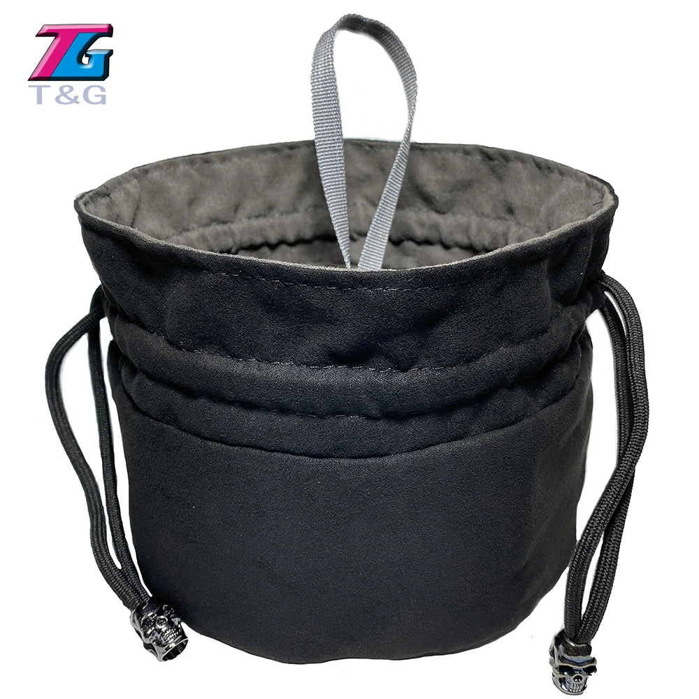 Black velvet dice storage pouch with a gray drawstring and attached metal charms