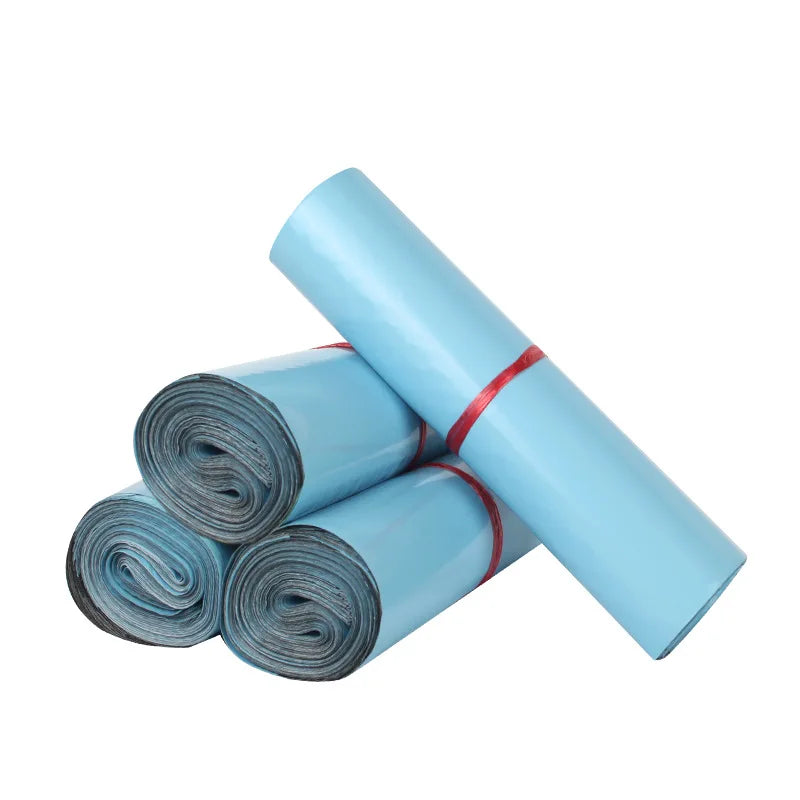 A roll of light blue heavy-duty waterproof poly mailer bags for shipping and storage.